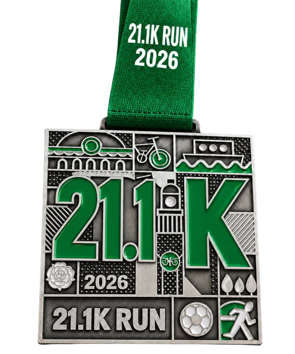 Half marathon medal: the same cast design with a green enamel 21.1K and a green printed ribbon