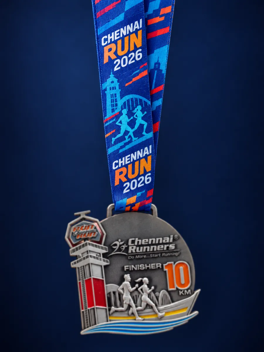 Full-colour printed ribbon with the race name and year, a silver 10 km finisher medal hanging below