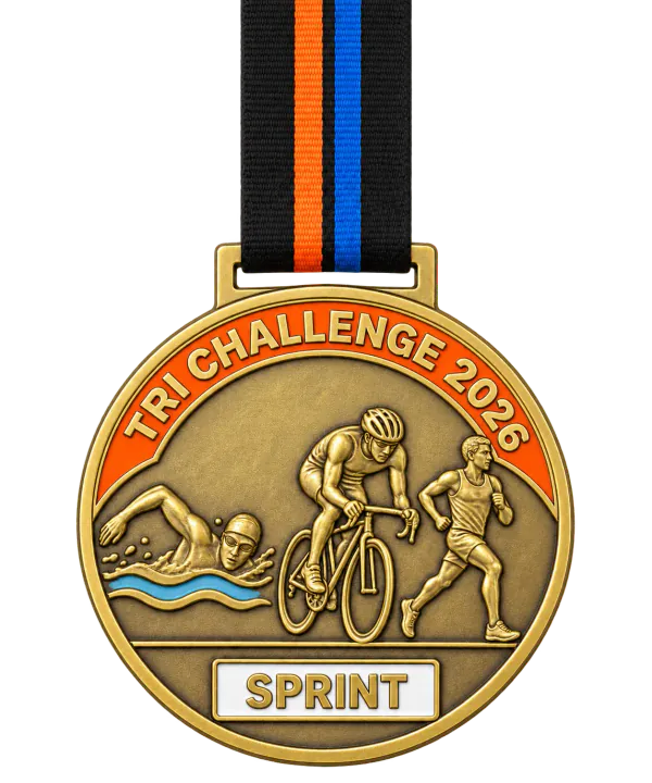 Triathlon medal TRI CHALLENGE 2026 with a orange enamel band and a SPRINT plate, a swimmer, a cyclist and a runner in relief