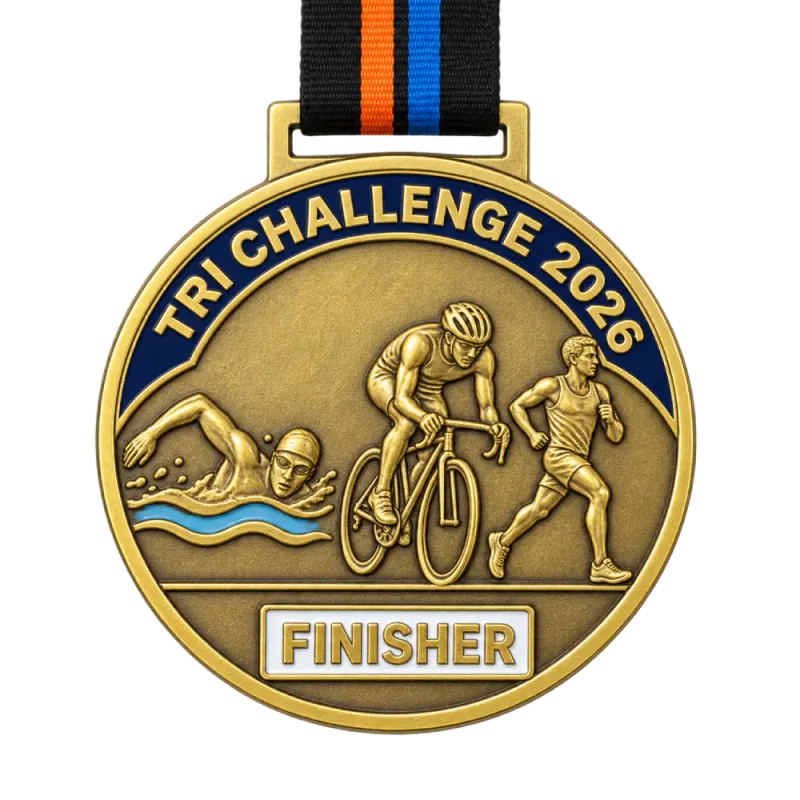 Cast 3D triathlon medal: a swimmer, a cyclist and a runner in shallow relief, TRI CHALLENGE 2026 on a navy enamel band and a FINISHER plate