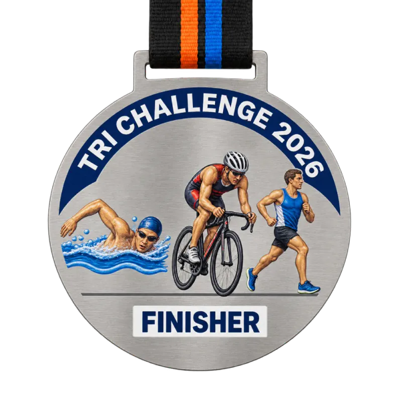 Printed steel triathlon medal: swimmer, cyclist and runner printed in full colour on brushed steel, TRI CHALLENGE 2026 and a FINISHER plate