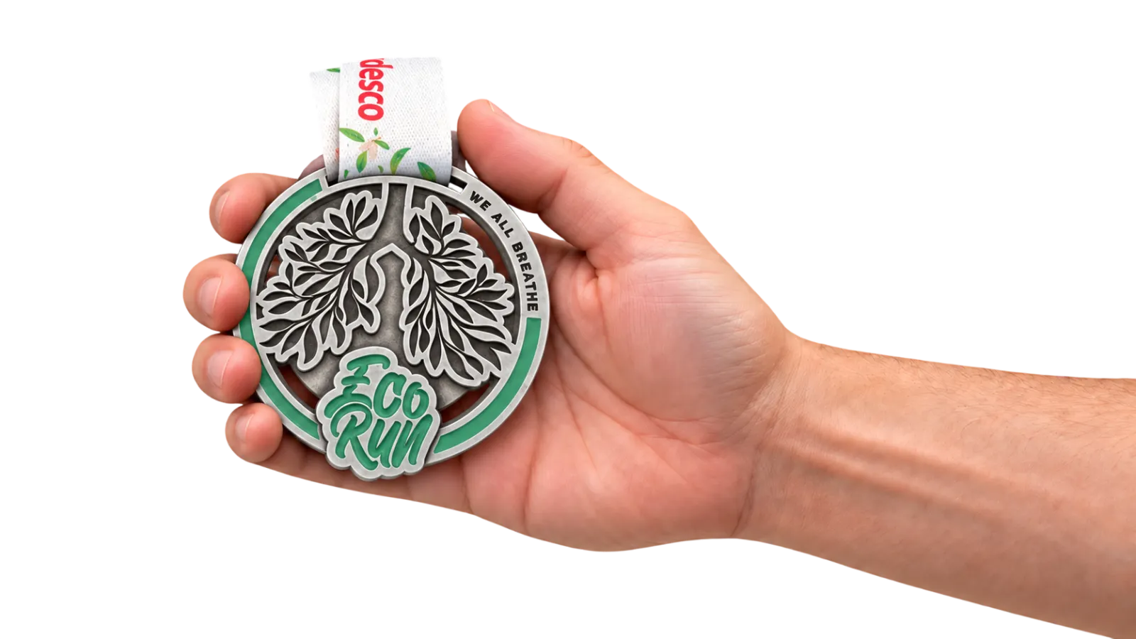 A 2D cast medal held in a hand, showing the real size next to the fingers