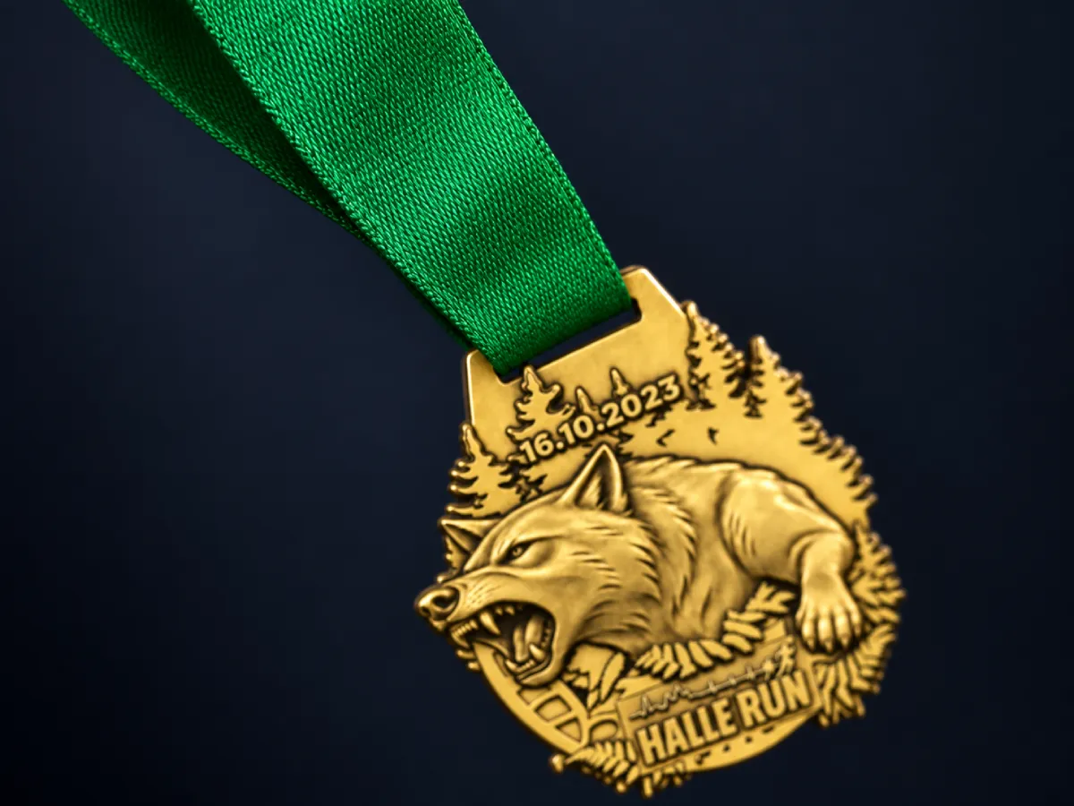 Medal hanging from a printed green ribbon, close-up of the weave