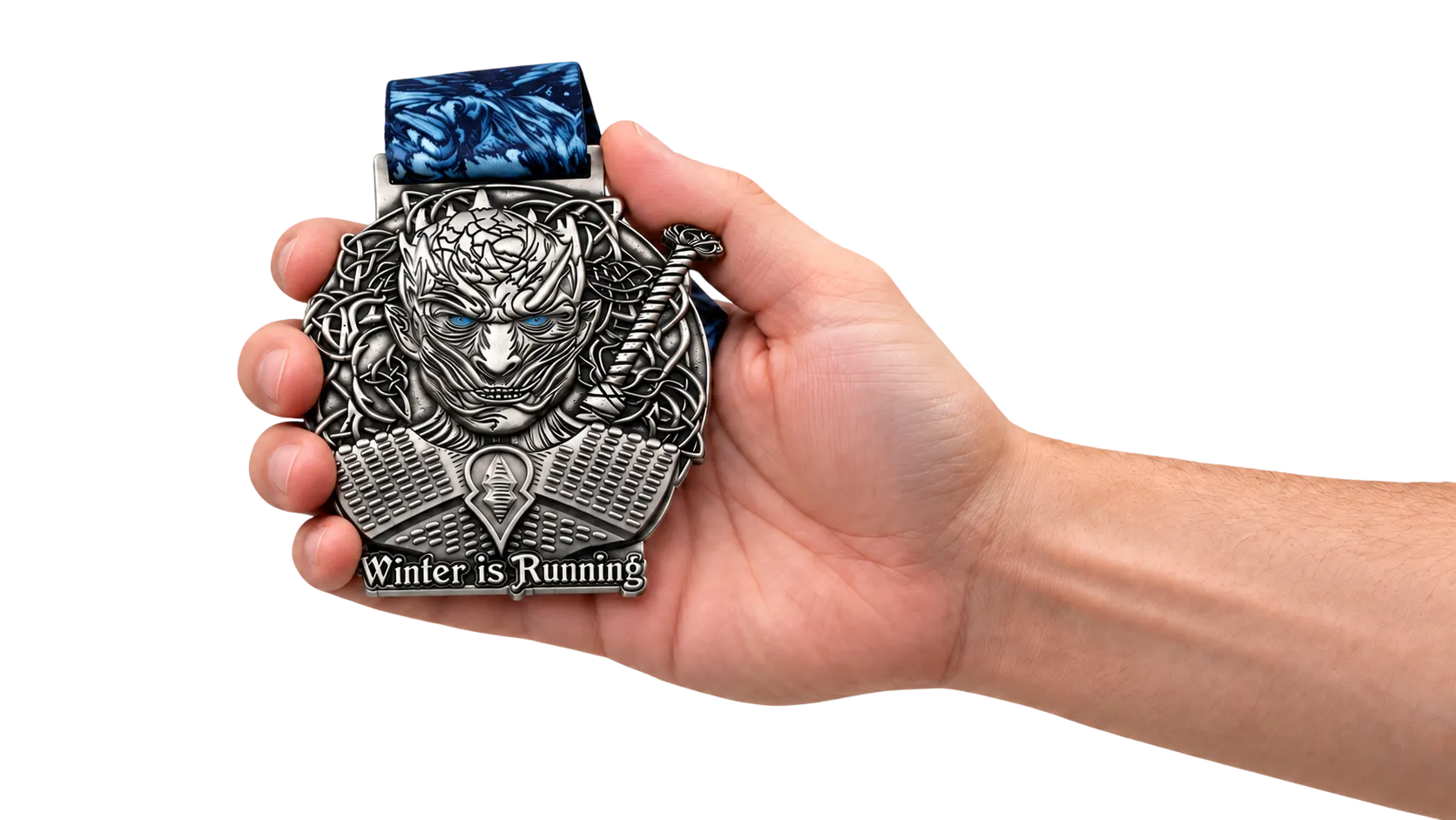 A 3D cast medal held in a hand, showing the real size and the depth of the relief