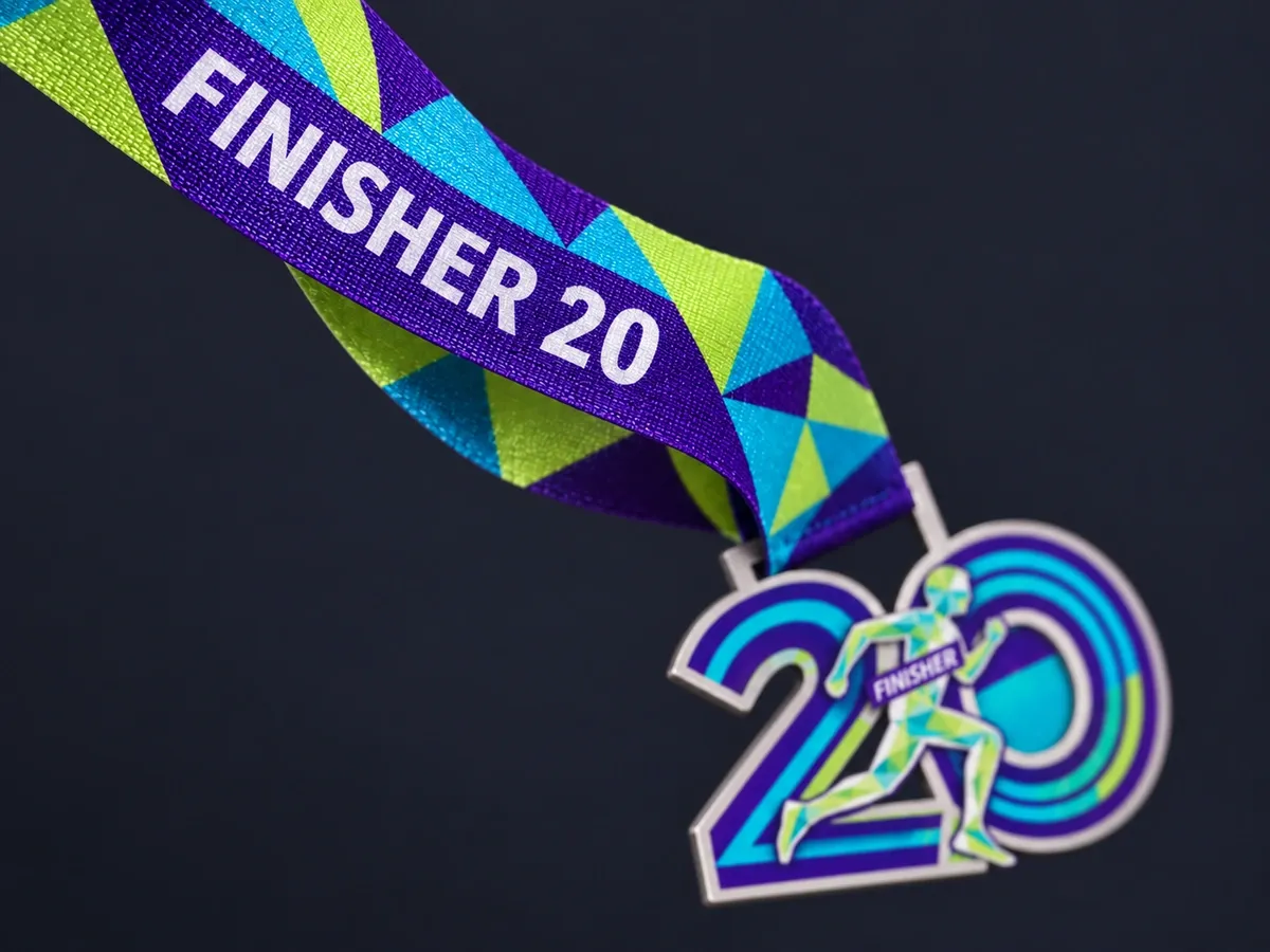 Printed steel medal hanging from a full-colour printed ribbon