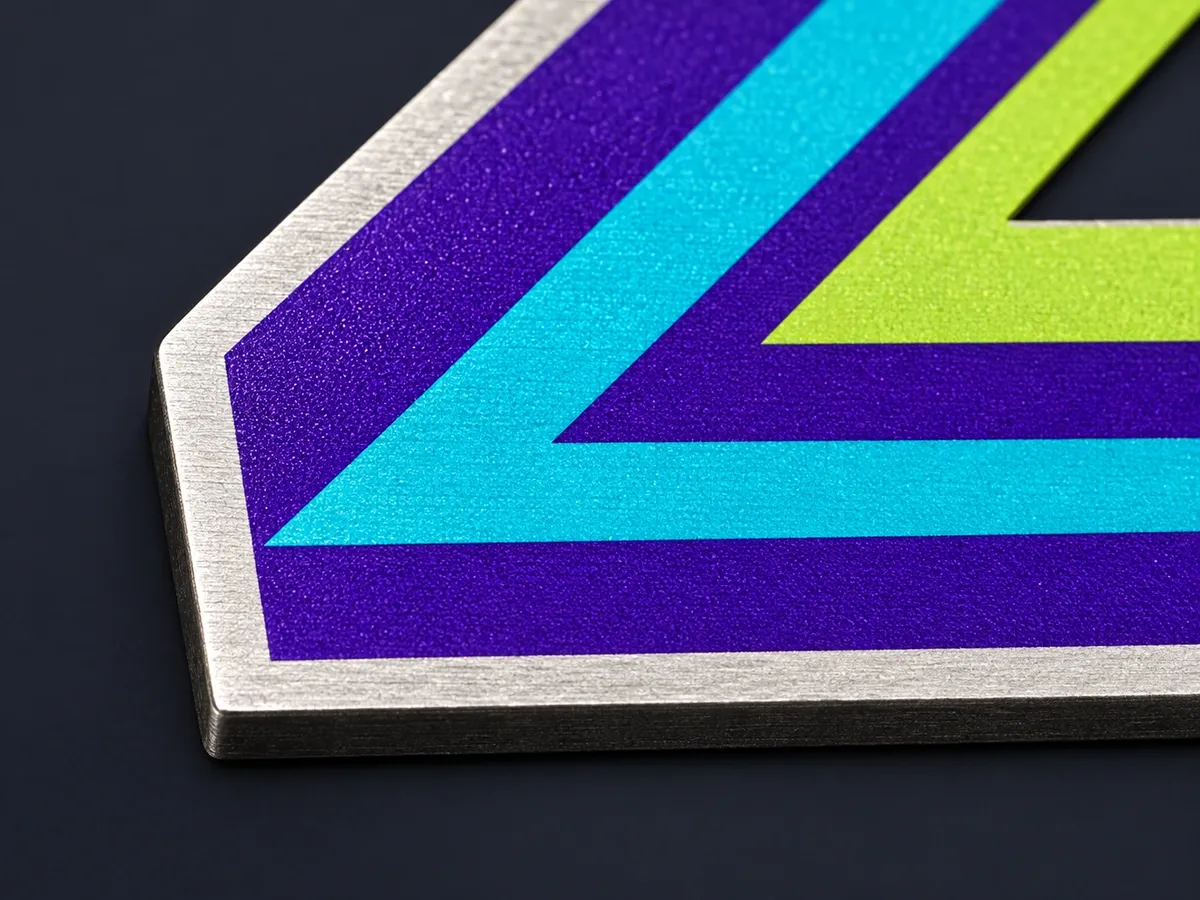 Macro of the print surface and the laser-cut edge of a steel medal