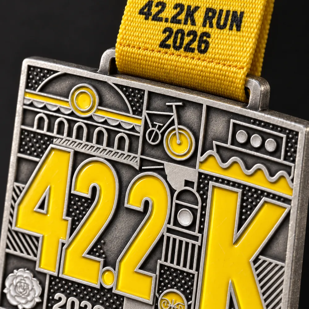 42.2K city run — square finisher medal — close-up of the enamel and the ribbon loop