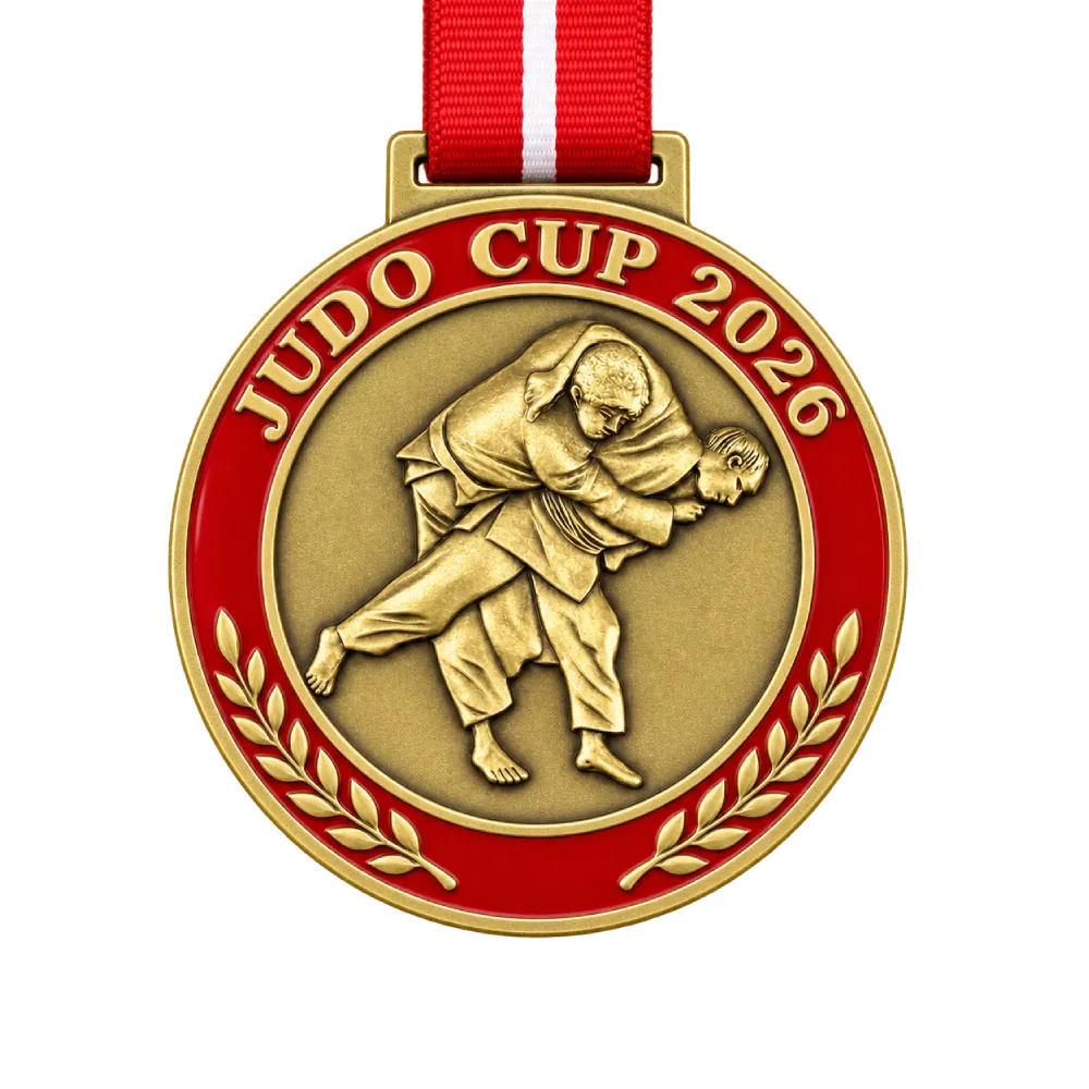 Gold cast judo medal: two fighters mid-throw in deep relief inside a red enamel ring with laurel branches