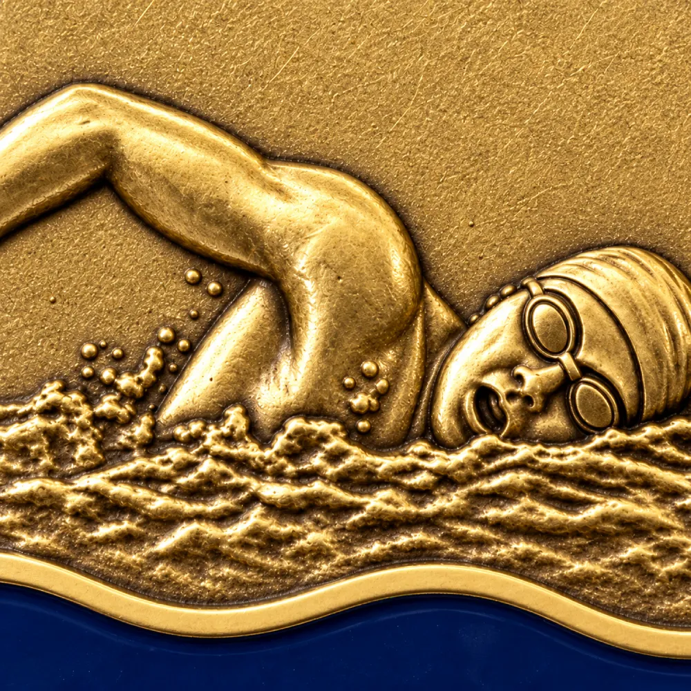 Swim gala — waves cast under the swimmer — close-up of the centre design